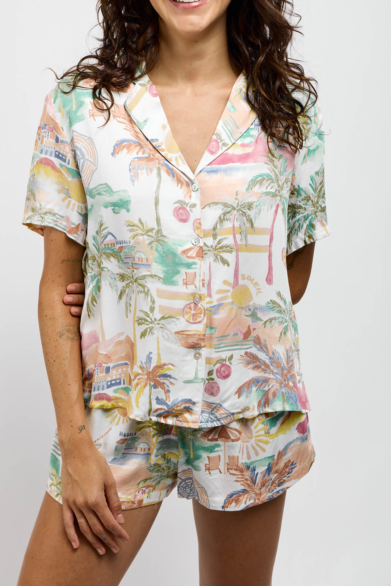 Womens buttondown top with collar that comes paired with matching shorts