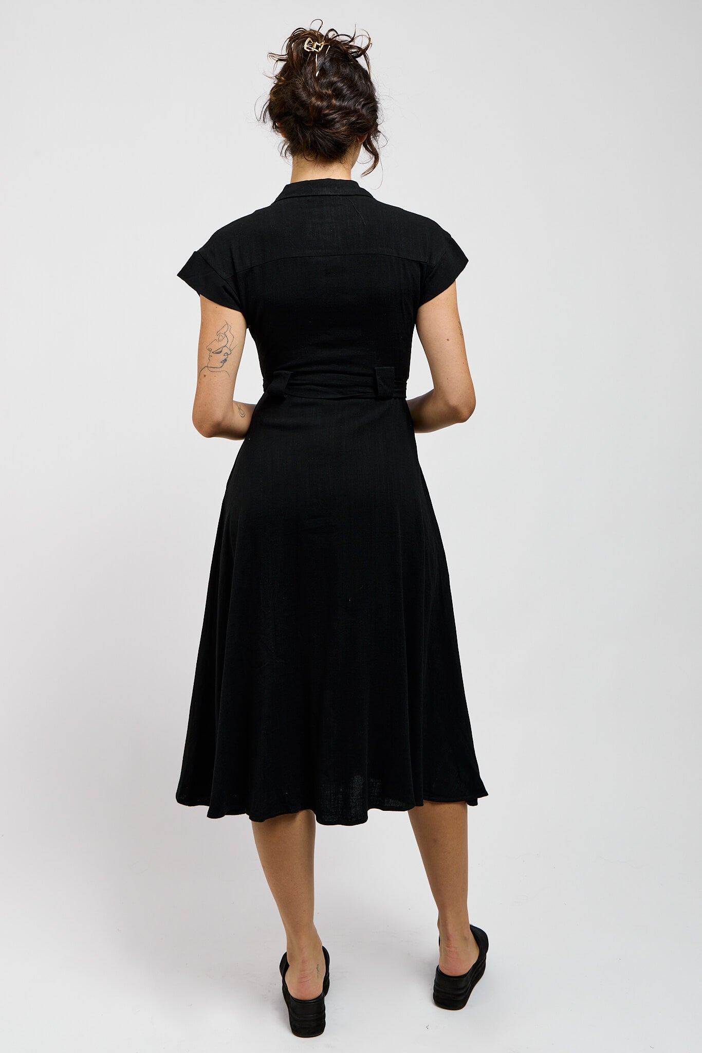 Womens black dress with fitted top and flowy skirt