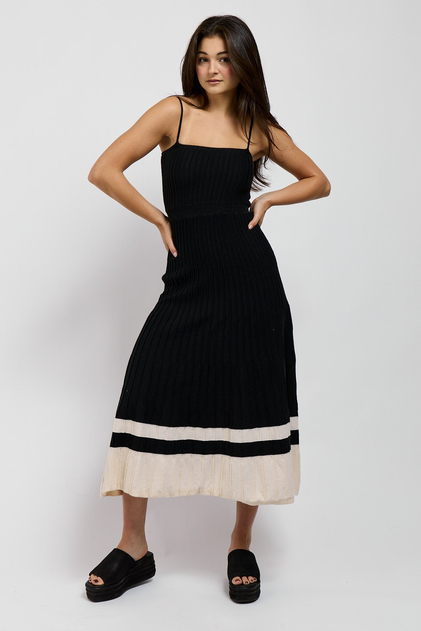 Womens black knit dress with spaghetti straps and two tone hem