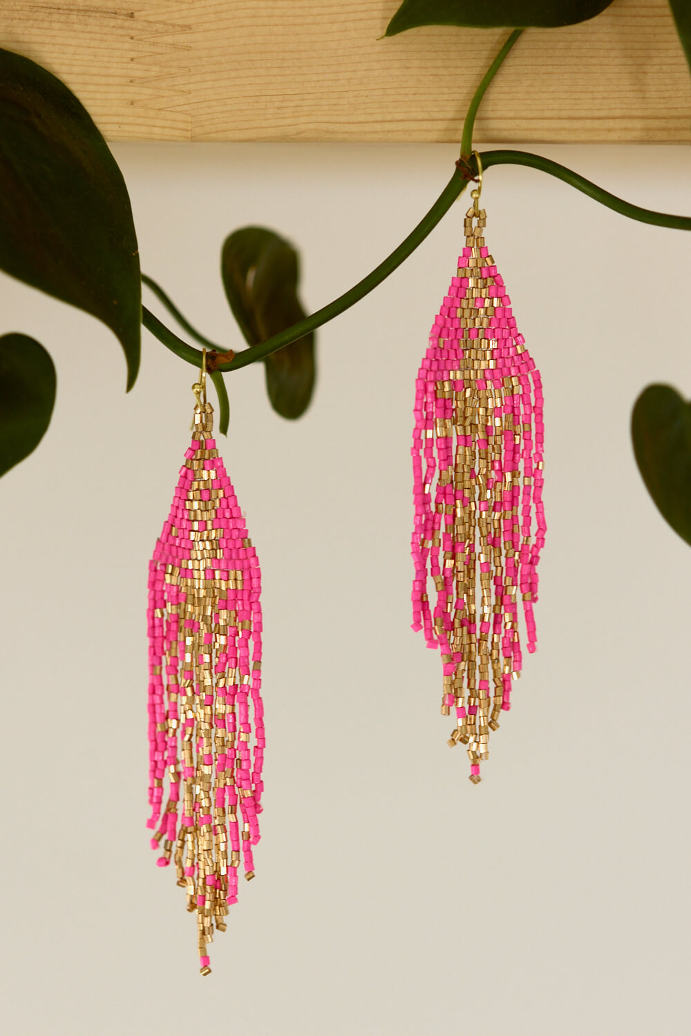 Women's pink and gold beaded earrings