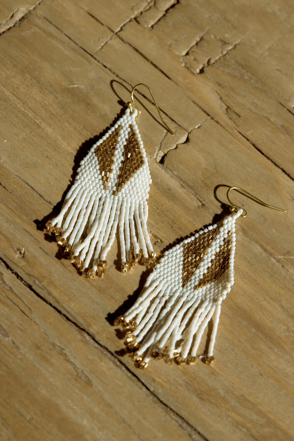 Gold drop earrings with gold detail