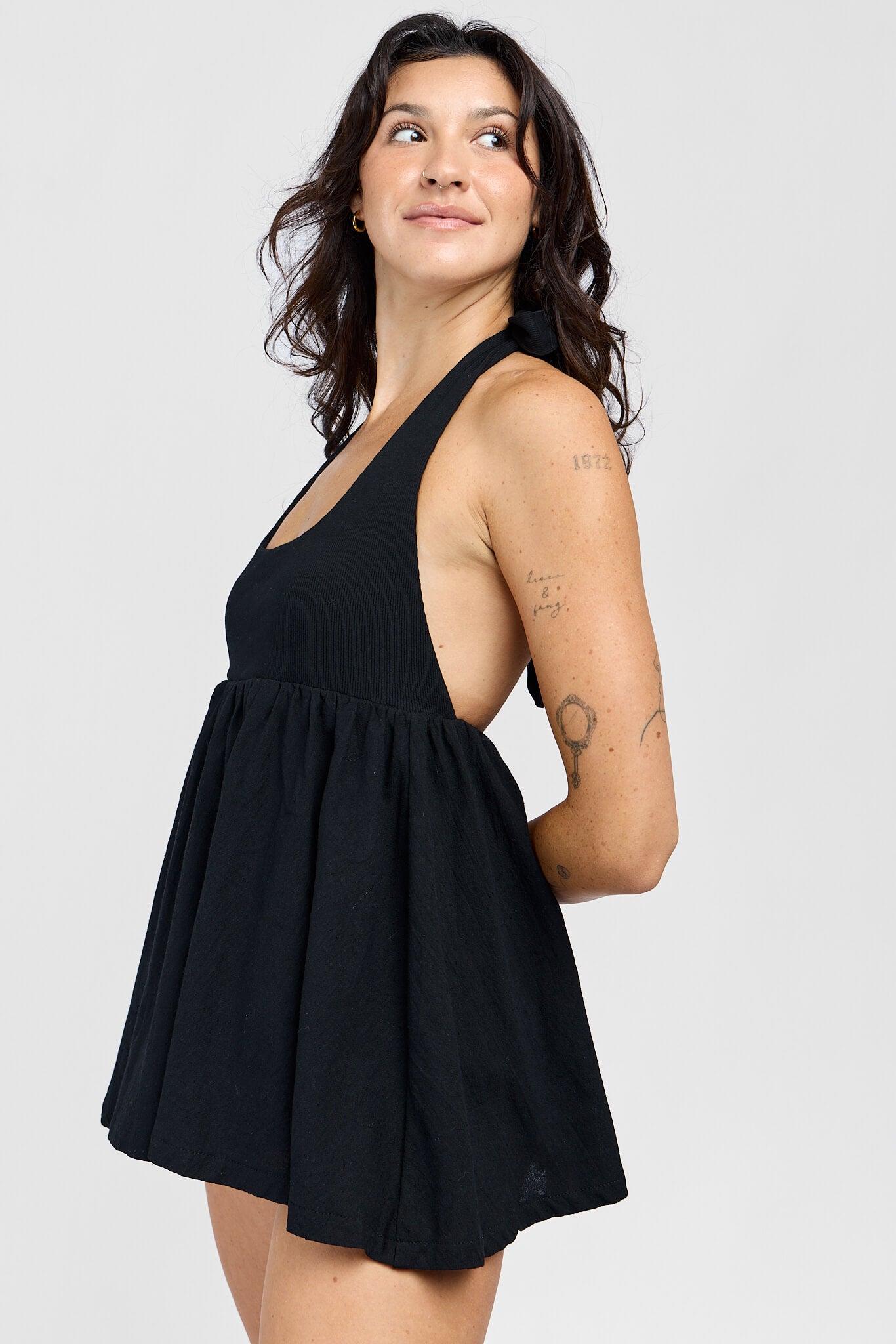 Womens black open back halter with shorts equipped