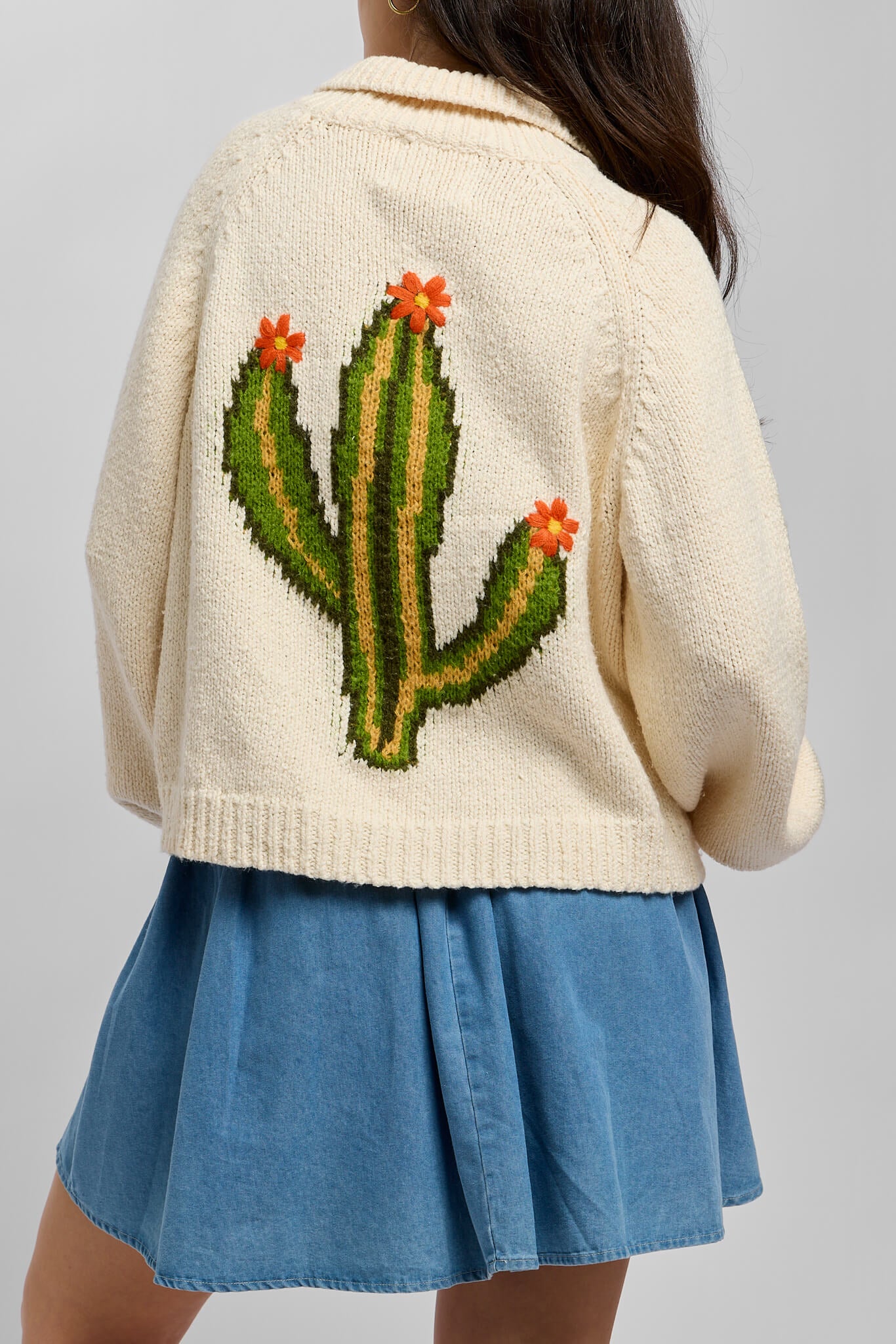 Womens cream colored knitted ivory cardigan with saguaro cactus knitted on back