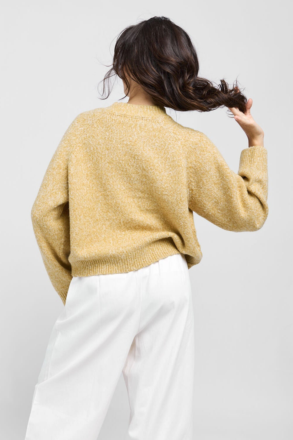 Womens knitted yellow crewneck sweater with a relaxed fit