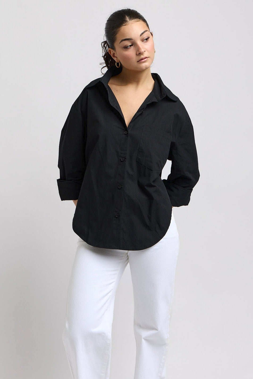 Womens black buttonup top with scooped edge sides