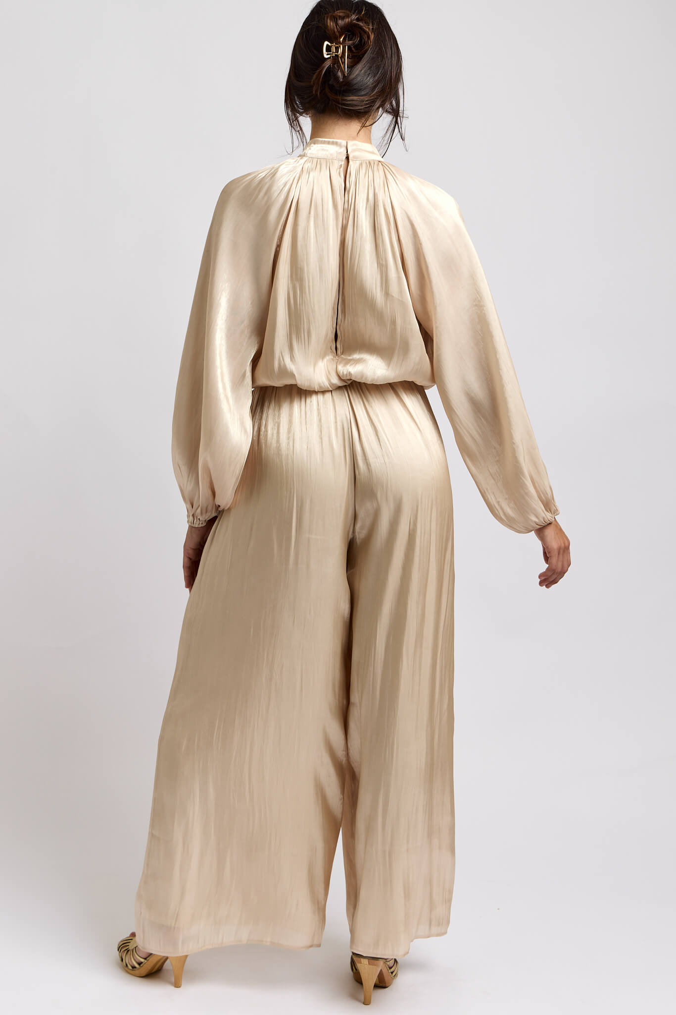 Womens jumpsuit with high neck button closure and keyhole opening down back