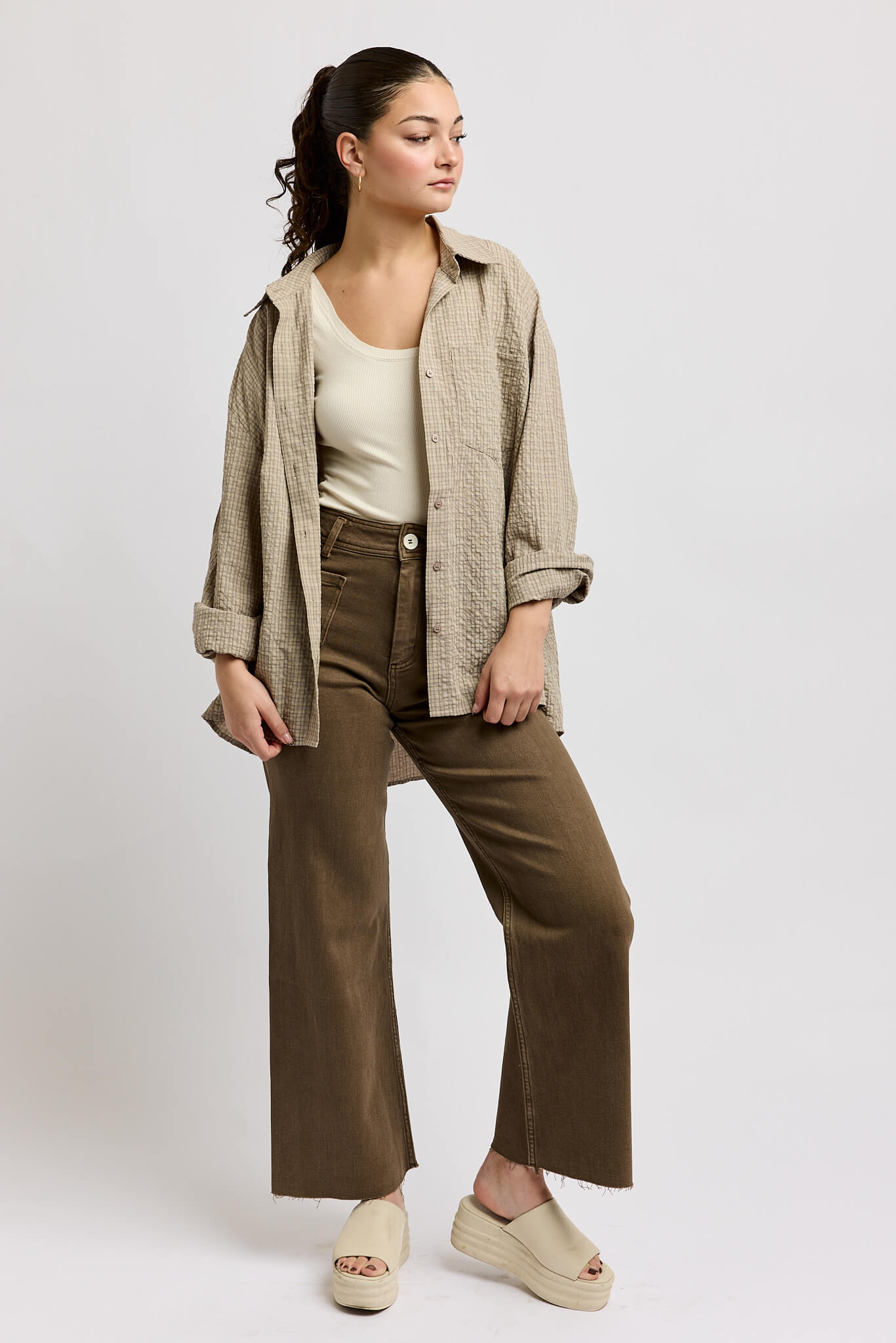 Womens brown hued jeans with button and zipper closure