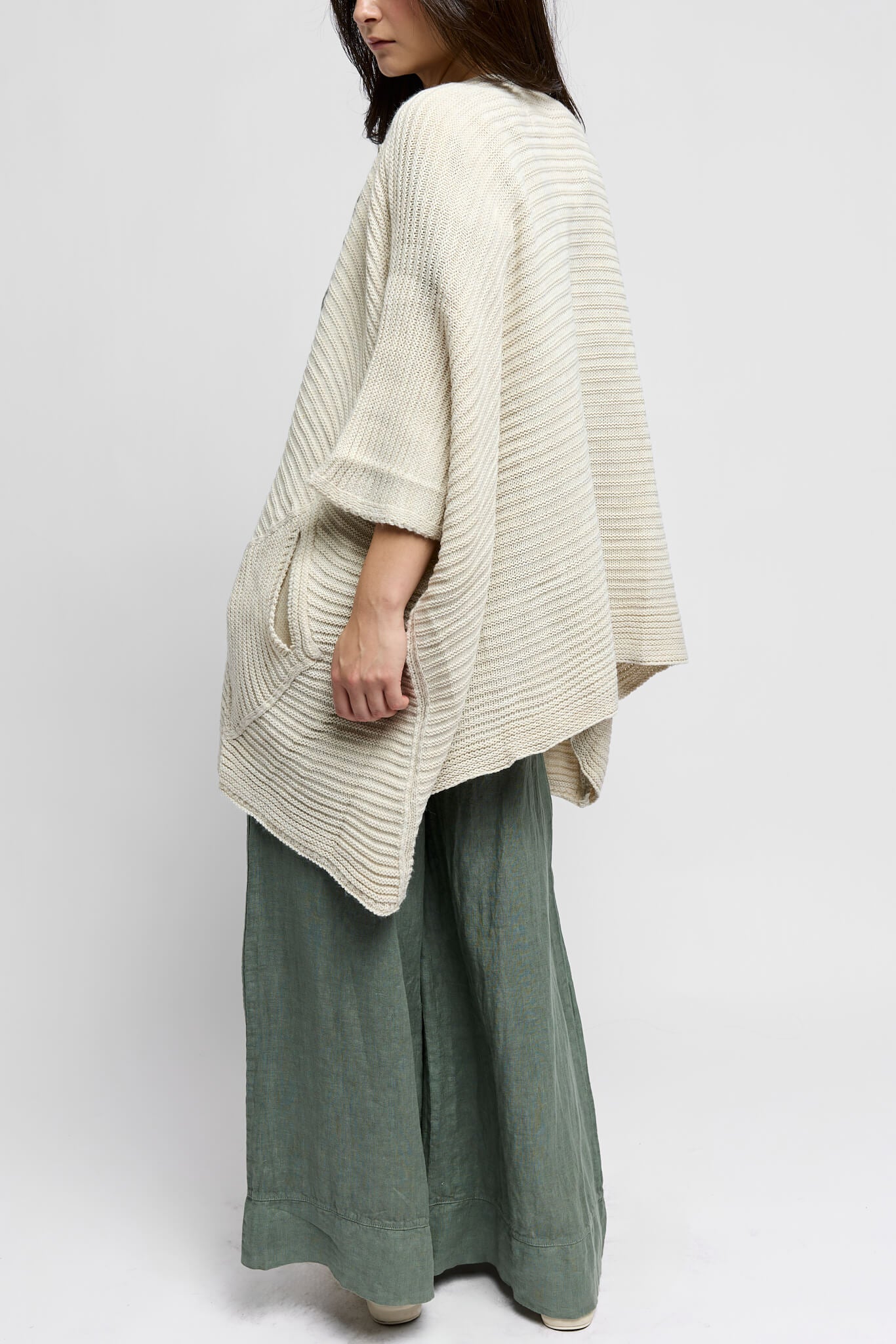 womens ivory colored cardigan with two front pockets and horizontal texture