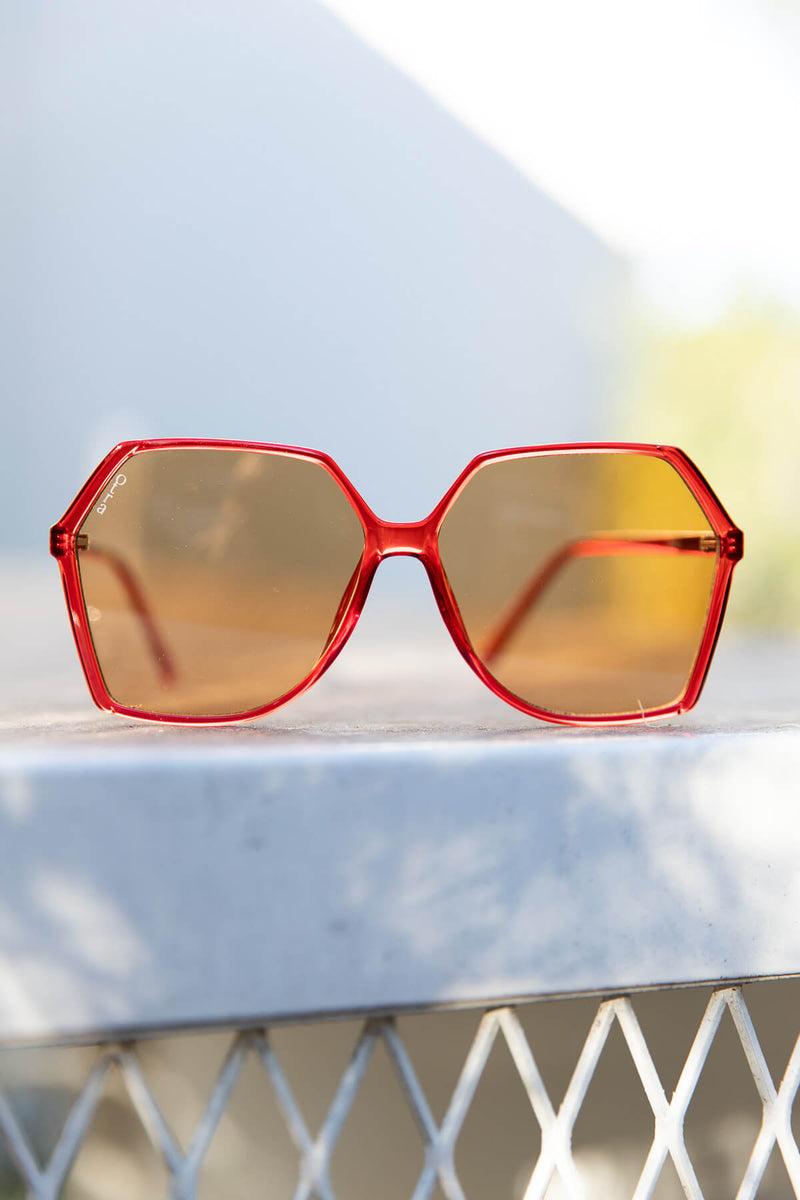 red 70s style sunglasses